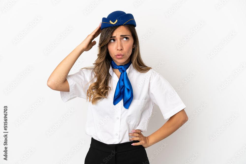 Airplane stewardess over isolated white background having doubts and with confuse face expression Airplane stewardess over isolated white background having doubts and with confuse face expression