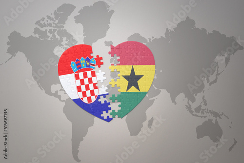 puzzle heart with the national flag of croatia and ghana on a world map background.Concept.