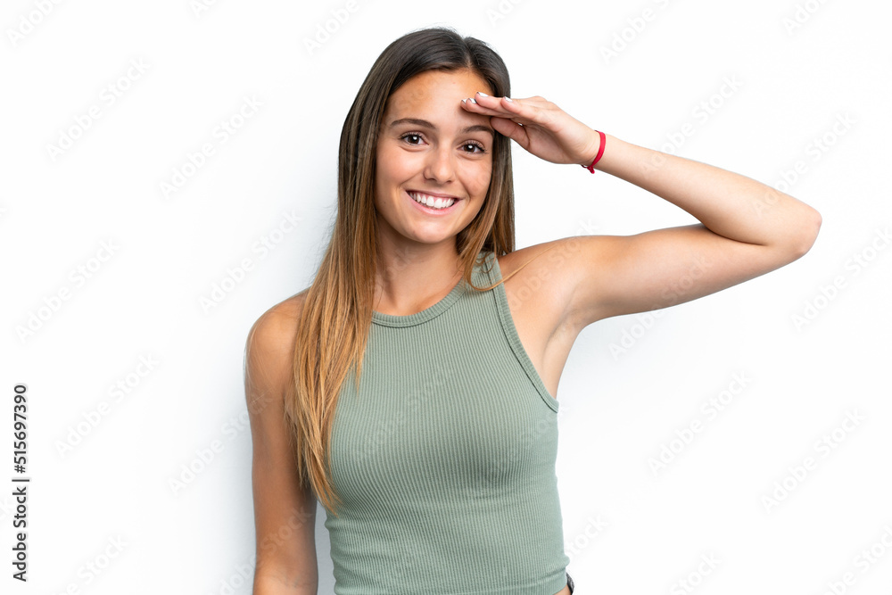 Young caucasian woman isolated on white background saluting with hand with happy expression Young caucasian woman isolated on white background saluting with hand with happy expression