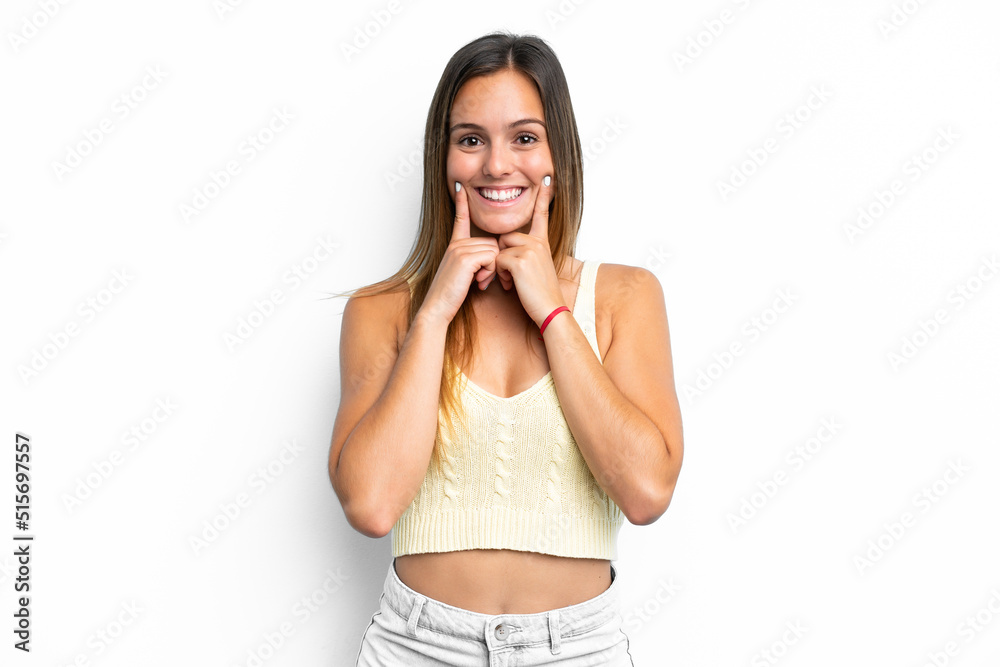 Fototapeta premium Young caucasian woman isolated on white background smiling with a happy and pleasant expression