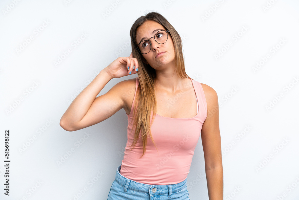 Young caucasian woman isolated on white background making the gesture of madness putting finger on the head Young caucasian woman isolated on white background making the gesture of madness putting finger on the head