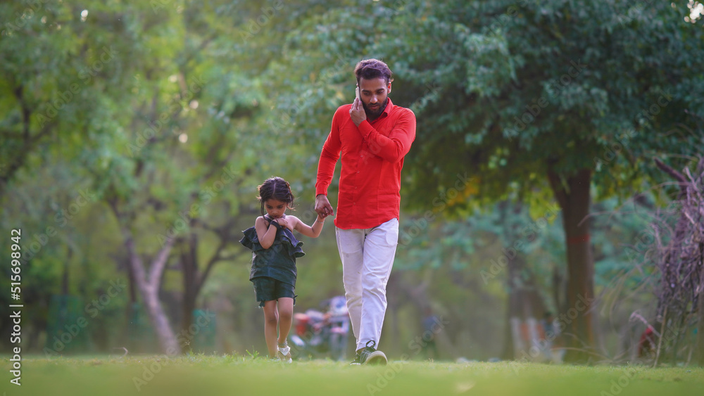 alone sad kid concept man is busy on call with cute baby girl in park images