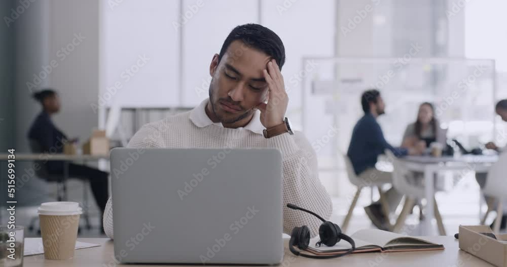 Stressed business man dealing with a work problem. Tired professional entrepreneur suffering from anxiety. Male freelance worker dealing with a work problem and feeling pain from a headache