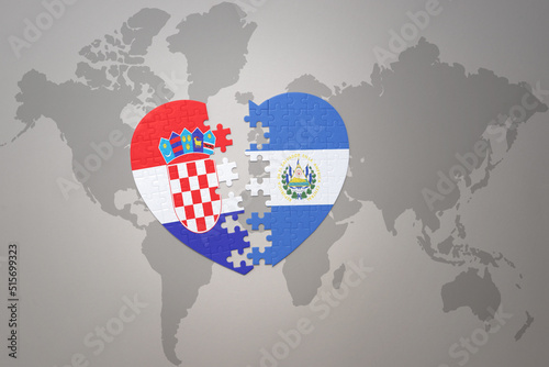 puzzle heart with the national flag of croatia and el salvador on a world map background.Concept.
