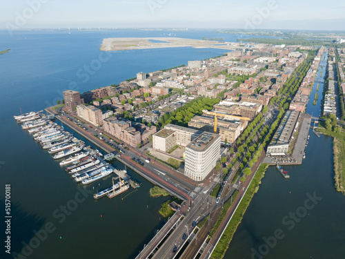 Amsterdam Ijburg artificial island modern residential area smart city cityscape at water Ijmeer. Urban houses buildings city environment area.