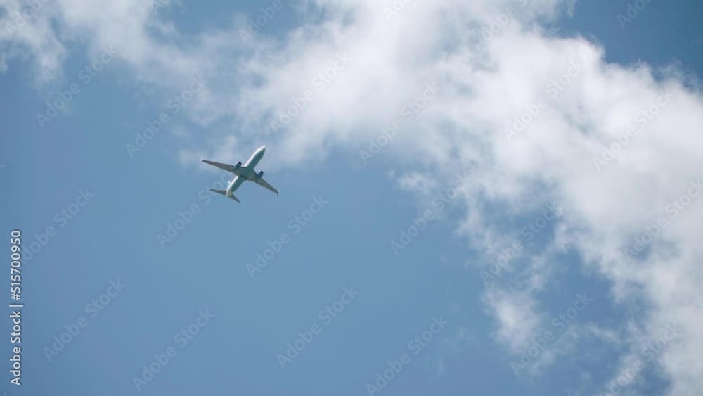 Passenger plane flying in the clouds Passenger plane flying in the clouds