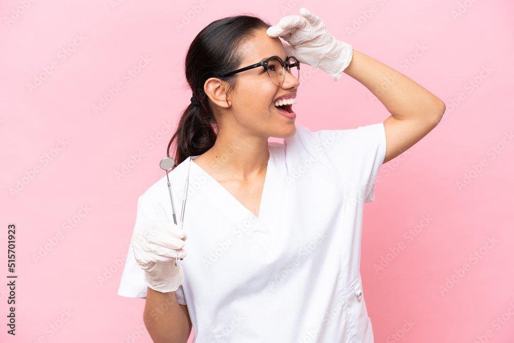 Dentist Colombian woman isolated on pink background smiling a lot Dentist Colombian woman isolated on pink background smiling a lot
