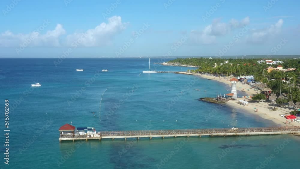 Dominicus beach at Bayahibe with Caribbean sea sandy seashore, lighthouse and pier. Aerial view from drone Dominicus beach at Bayahibe with Caribbean sea sandy seashore, lighthouse and pier. Aerial view from drone