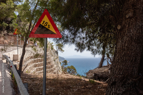 view of the new road with sign to the egremni beach lefkas greece during warm day