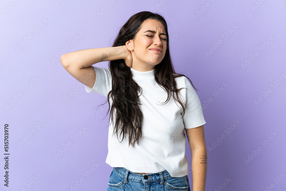 Young caucasian woman isolated on purple background with neckache Young caucasian woman isolated on purple background with neckache