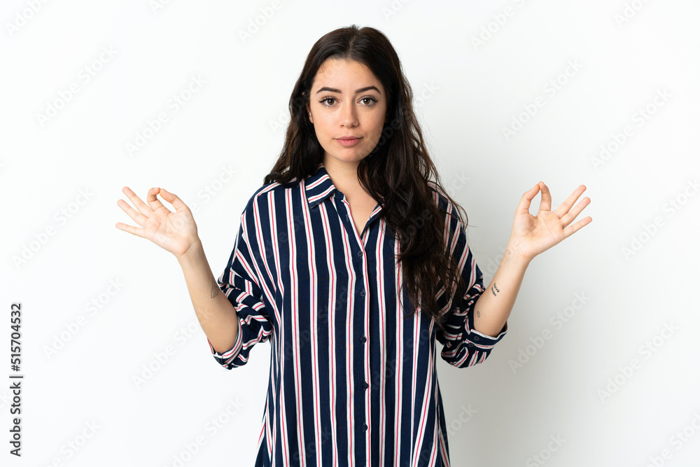 Young caucasian woman over isolated background in zen pose