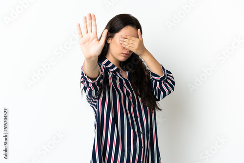Young caucasian woman over isolated background making stop gesture and covering face