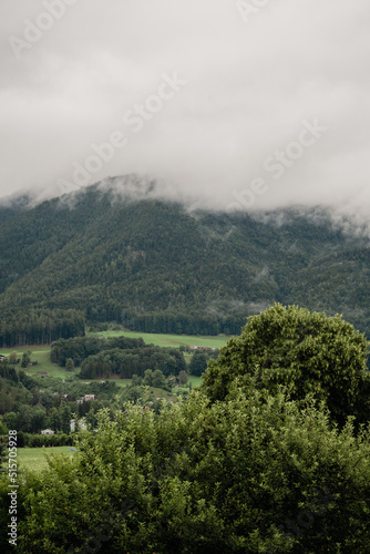 mountain village in the fog in austria during summer holiday