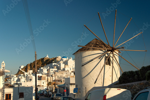View over famous windmills and Chora town with traditional style white houses on Serifos island in Greece