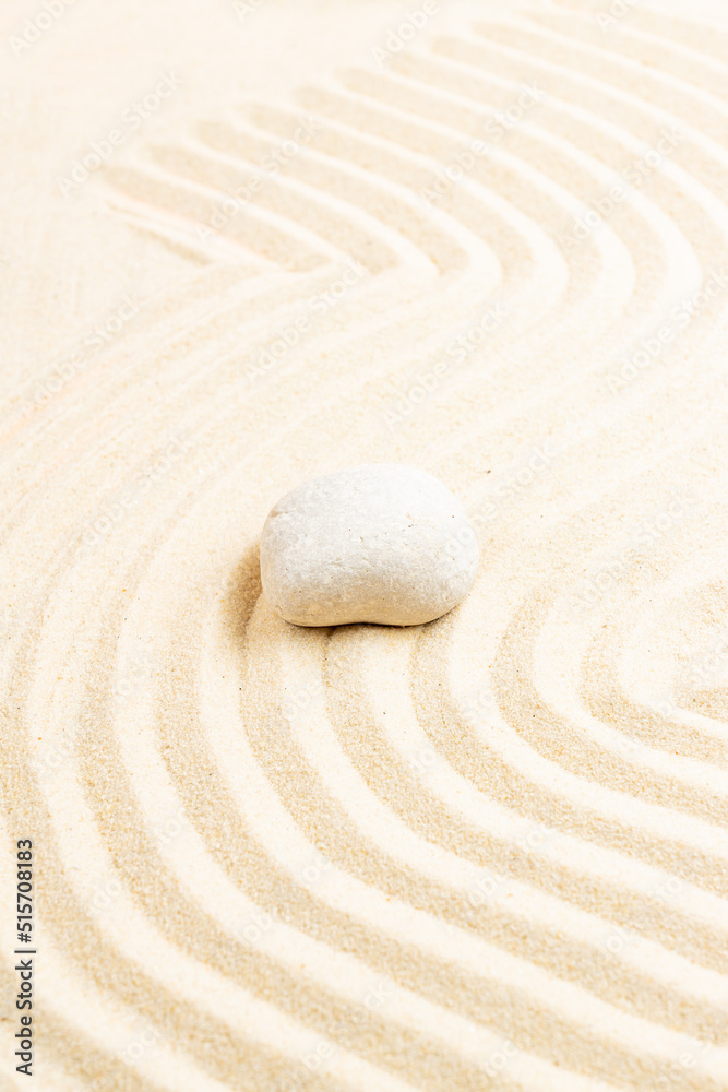 Obraz premium Japanese Zen stone garden. relaxation, meditation, simplicity and balance concept. pebbles and wavy sand tranquil calm scene
