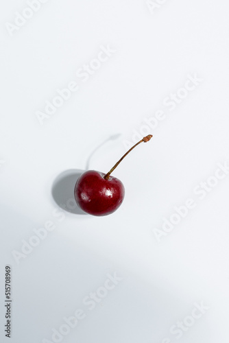 
cherries on a white background, hard light