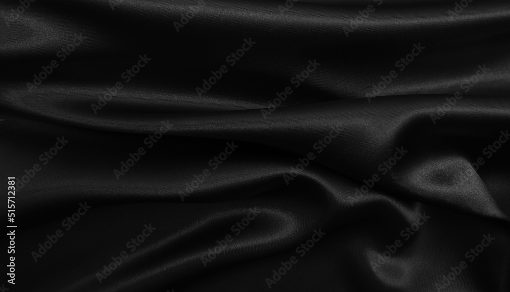 Obraz premium Smooth elegant black silk or satin texture as abstract background. Luxurious background design