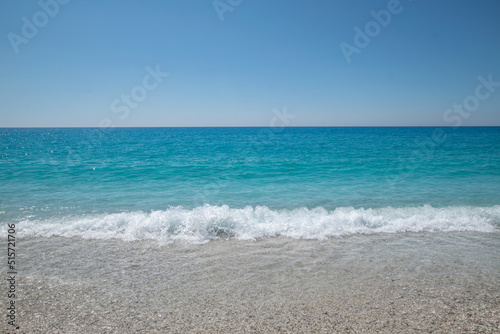 Turquoise sea and waves at Lefkada island during summer in Greece