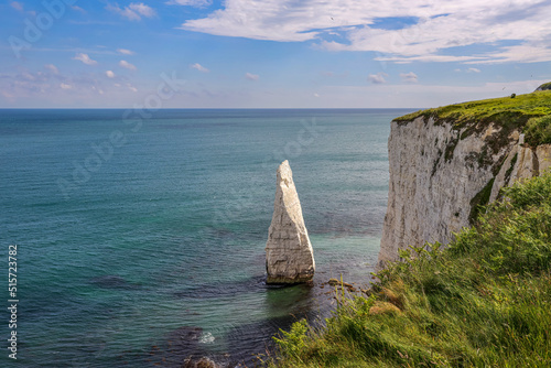 The scenic view of Old Harry Rocks. Old Harry Rocks are three chalk formations, including a stack and a stump, located at Handfast Point, on the Isle of Purbeck in Dorset, southern England. photo