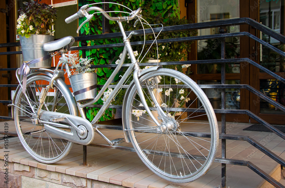 Silver bike near the cafe