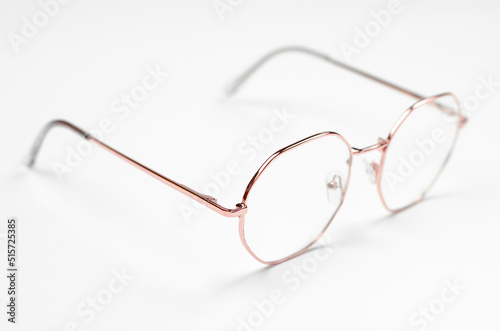 Stylish eyeglasses on a white background. Iron frame glasses