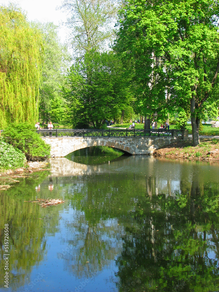 Lake with brige in the Arboretum in park Alexandria, Belaya Tserkov, Ukraine Lake with brige in the Arboretum in park Alexandria, Belaya Tserkov, Ukraine