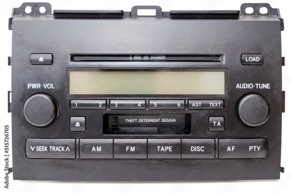 Old car audio CD and cassette player 2 DIN. On a lite background Old car audio CD and cassette player 2 DIN. On a lite background