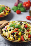 A bowl with traditional Italian pasta salad	