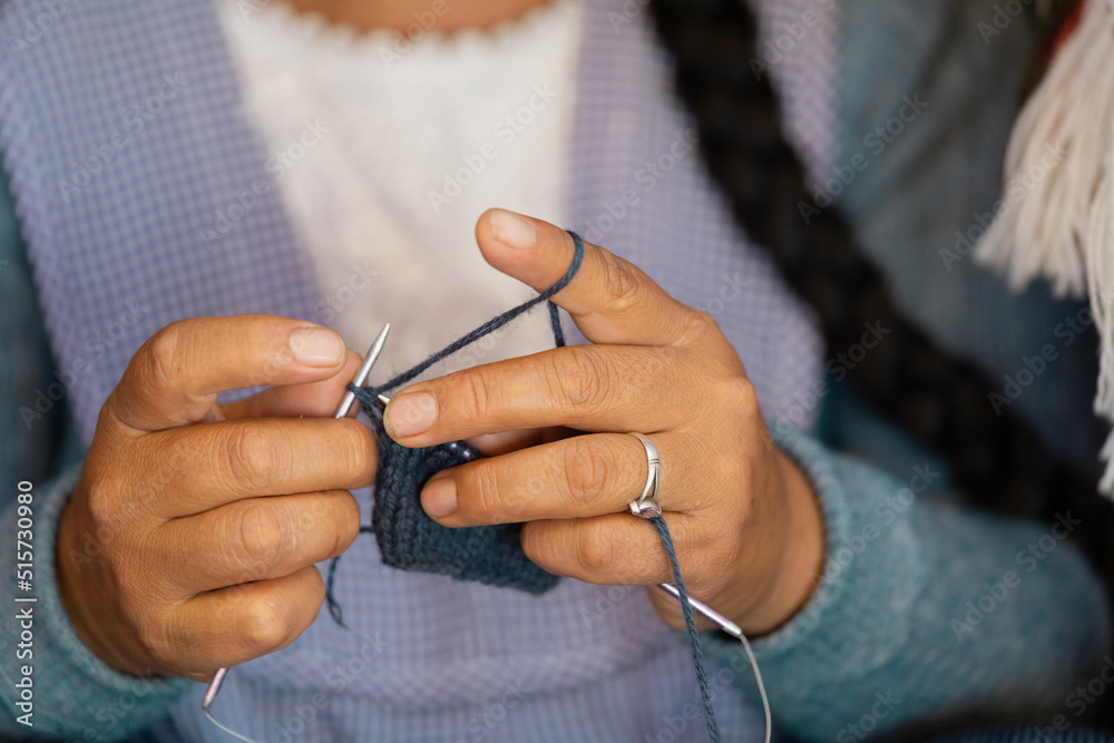 Close-up of a latin woman's hands weaving