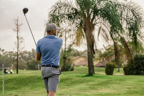 a golfer watching his shot