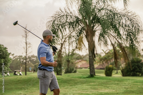 a golfer happy with his tee shot