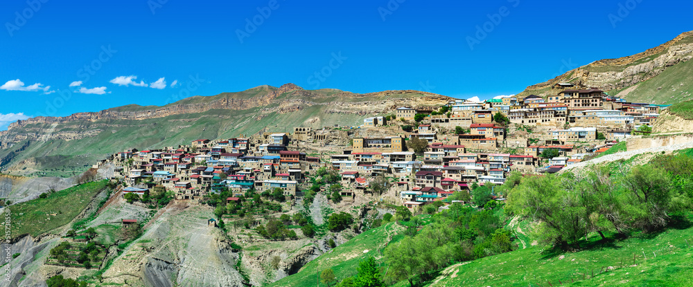 panorama of the entire ancient mountain village Chokh on a rocky slope in Dagestan