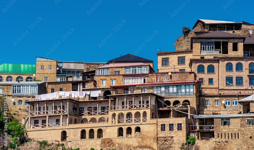 facades of houses located in tiers on a steep slope in the village of Chokh in Dagestan
