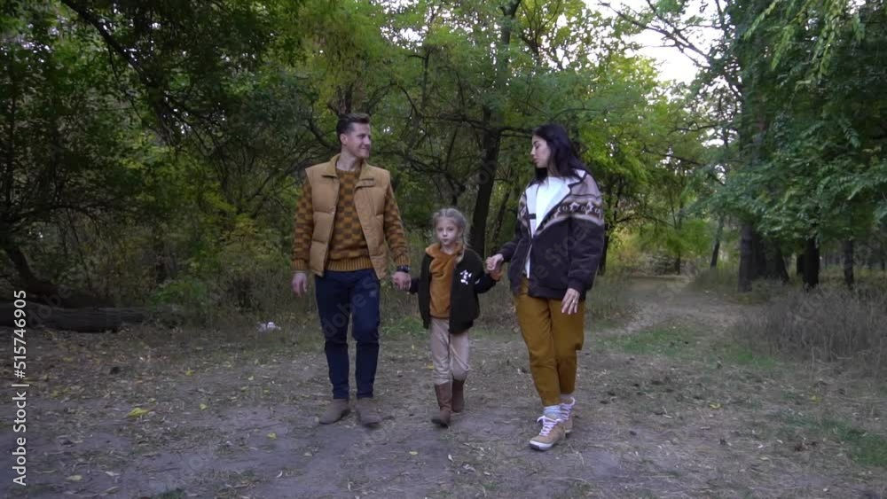 Slow Motion Family Walking Along Autumn Path Slow Motion Family Walking Along Autumn Path