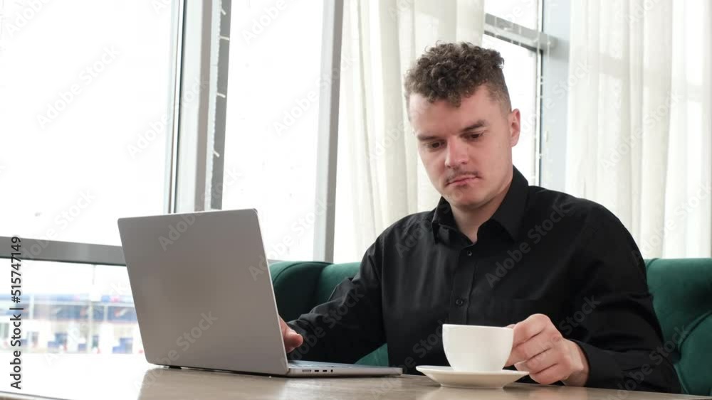 Fashionable hipster working in a coffee shop Fashionable hipster working in a coffee shop
