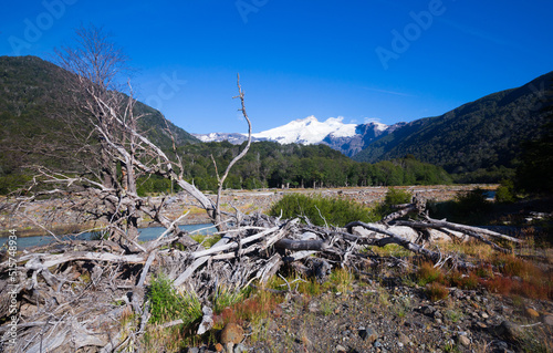 Cauquenes River view with snowy top of Tronador volcano at distance in Argentina