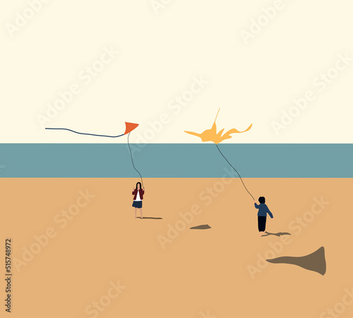 Children playing with kites on the beach during summer vacation. Spending vacation time in nature.