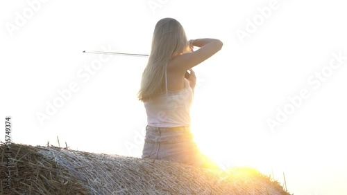 Slow Motion Attractive woman playing the violin on outdoors