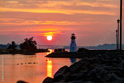 lighthouse with sunset and reflections