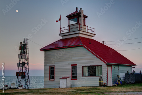 lighthouse on the coast at sunset