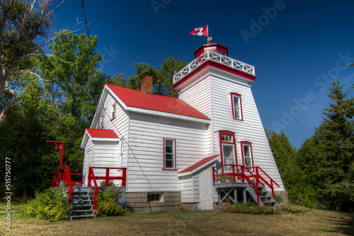 lighthouse with Canadian flag