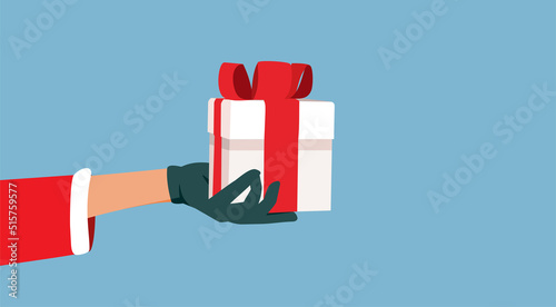 Santa Claus Holding a Christmas Gift Vector Cartoon Illustration - Hand delivering an Xmas present on winter holidays season
