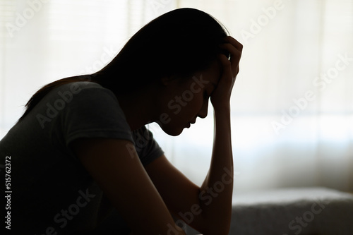 Papier peint Silhouette photo of young Asian woman feeling upset, sad, unhappy or disappoint crying lonely in her room