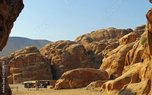 tents of a camp of a nomadic tribe in the canyon inside the mountainous rocks in the Middle Eastern desert photo