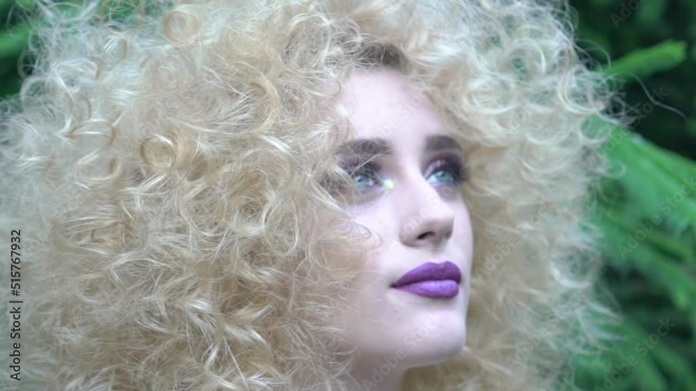 A young woman takes time out to relax in a field