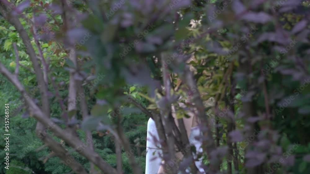 Slow Motion Beautiful blond smiling woman with afro curly hair in the field