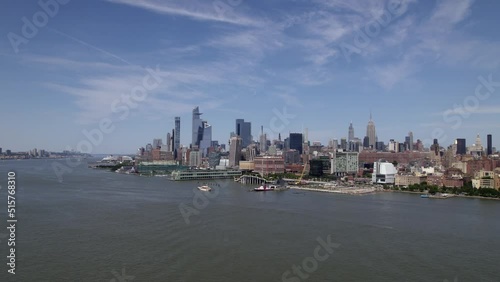 Aerial view over the river, towards the FDNY Marine 1, in sunny New York, USA photo