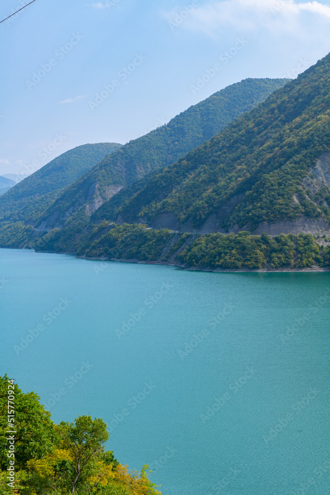 Naklejka premium bare lake between the mountains and blue sky