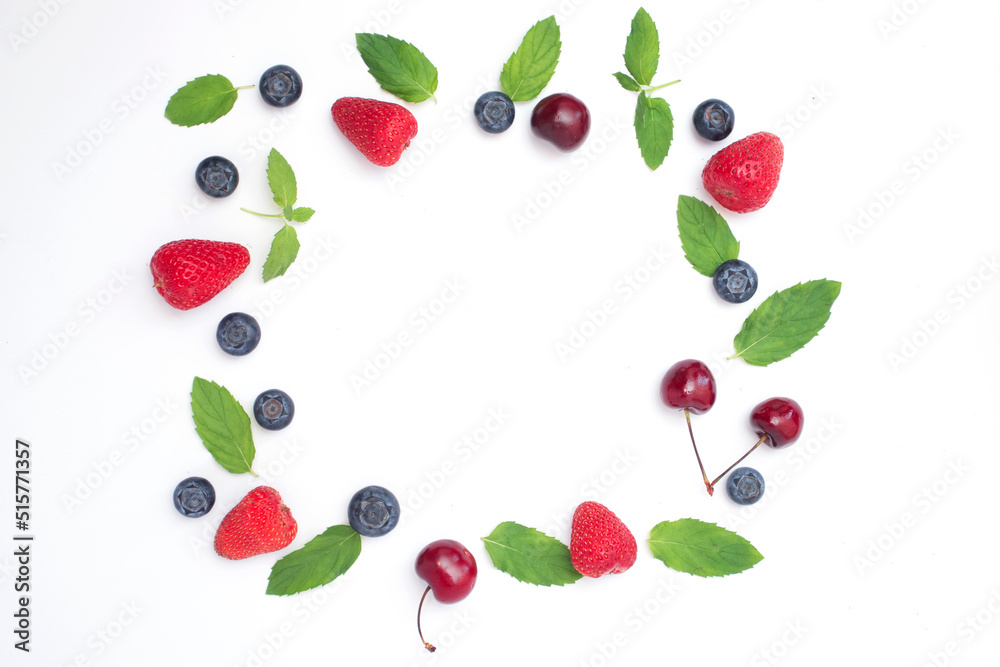 Frame of fresh mix berries with free space. Fruits frame with Blueberries, strawberries and cherry Frame of fresh mix berries with free space. Fruits frame with Blueberries, strawberries and cherry