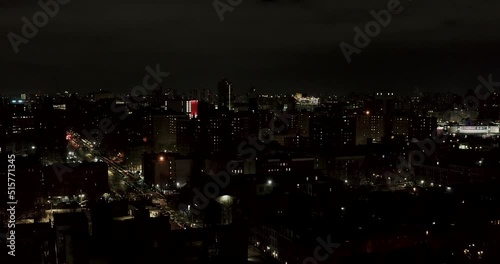 Wallpaper Mural Nighttime aerial flight over the rooftops of Harlem New York City in the winter Torontodigital.ca
